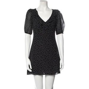 Reformation Black and White Polka Dot Mini Dress. Ruffle v-neck with puff sleeve